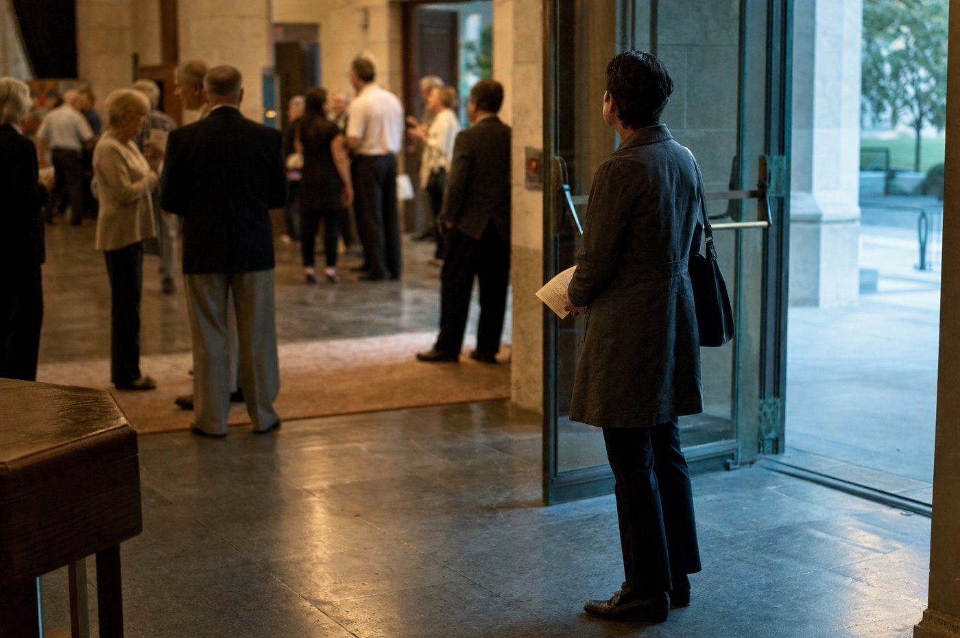 Visitor alone at the church entrance after the service